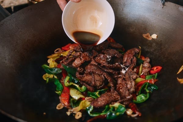 Pouring sauce into wok, thewoksoflife.com
