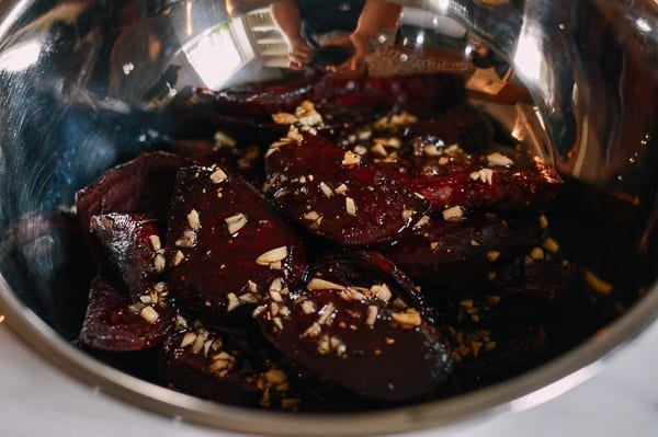 Tossing beets in dressing, thewoksoflife.com