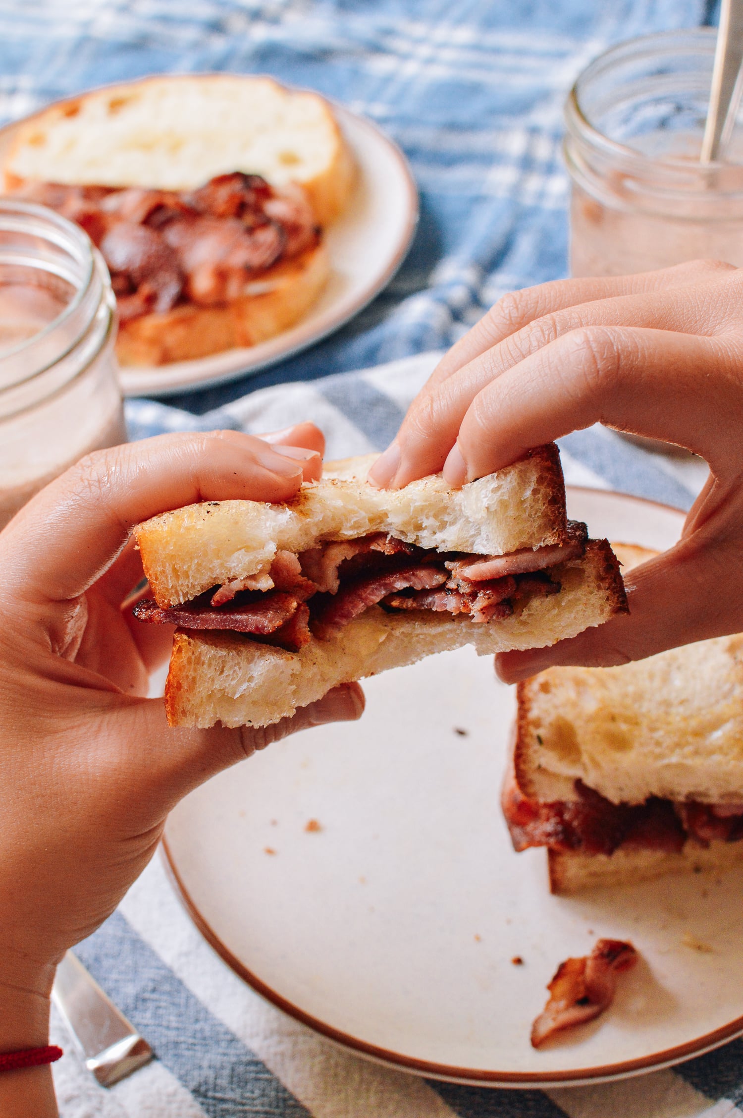 Bite taken out of bacon sandwich, thewoksoflife.com