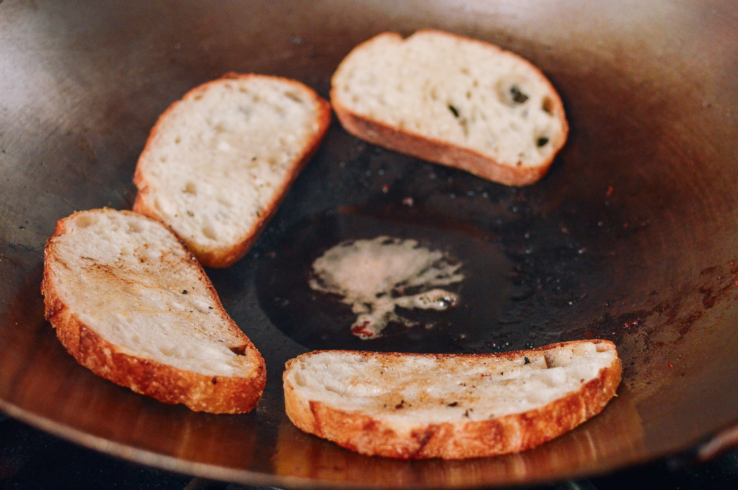 Toasting bread in bacon drippings, thewoksoflife.com