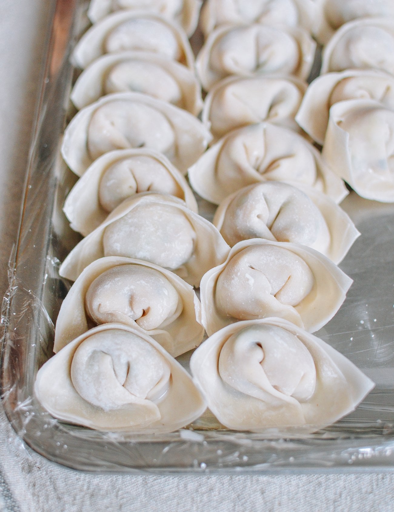 assembled wontons on sheet pan