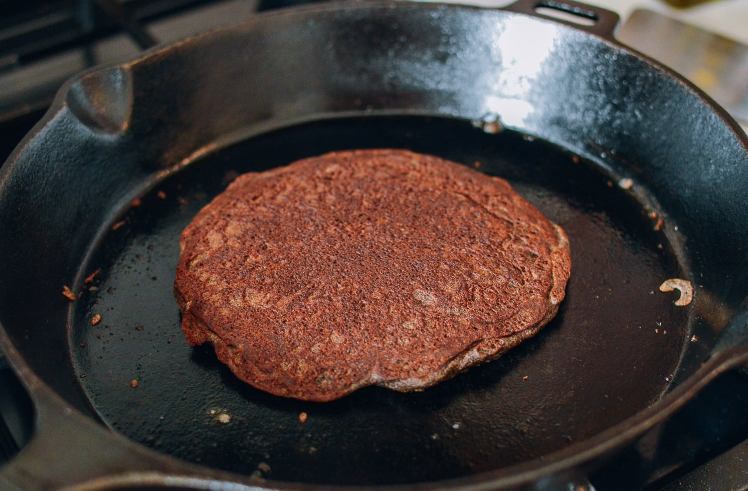 Cooking buckwheat pancakes in cast iron skillet, thewoksoflife.com