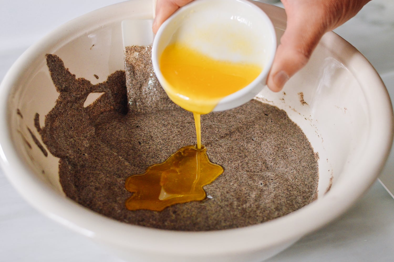 Folding in cooled melted bytter, thewoksoflife.com