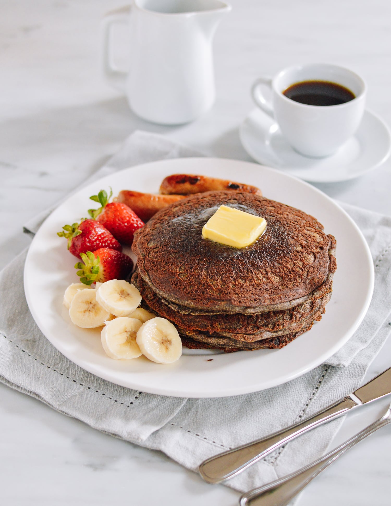 Stack of buckwheat pancakes with fruit, thewoksoflife.com