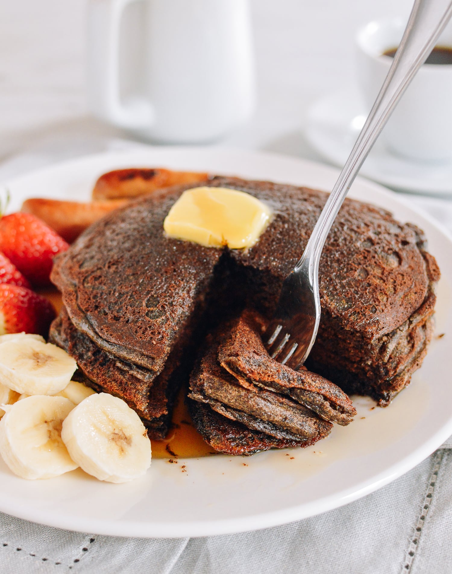 Digging into stack of pancakes, thewoksoflife.com