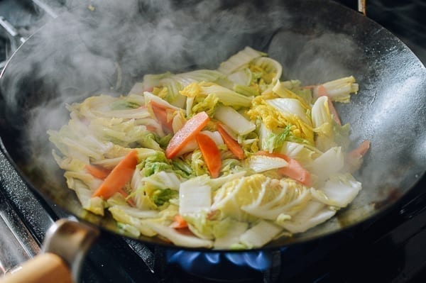 Napa cabbage leaves cooked until wilted, thewoksoflife.com