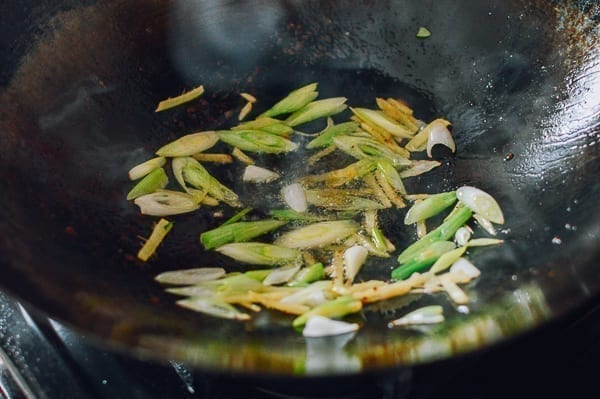 Ginger and scallions cooking in wok, thewoksoflife.com