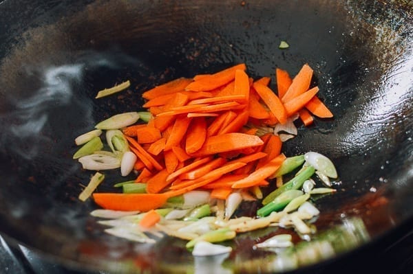 Adding carrots to ginger and scallions, thewoksoflife.com