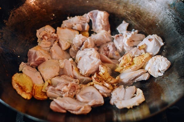 Searing chicken with ginger in a wok, thewoksoflife.com