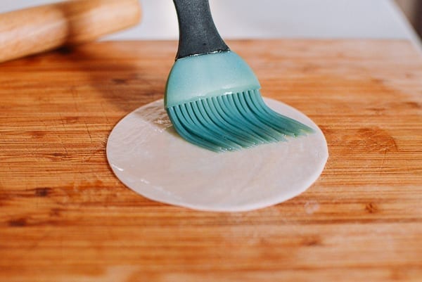 Brushing oil on dumpling wrapper, thewoksoflife.com