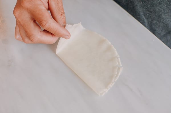 Folding mandarin pancake for serving, thewoksoflife.com