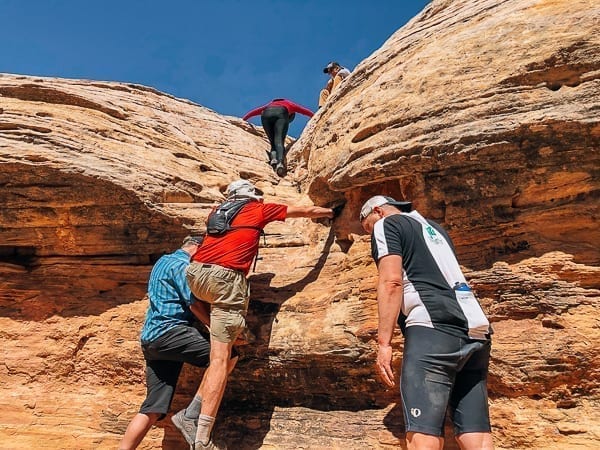 Climbing out of Holeman Slot canyon - Canyonlands National Park by thewoksoflife.com