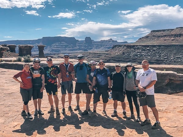 Musselman Arch Rim Tours Mountain Biking tour group photo by thewoksoflife.com