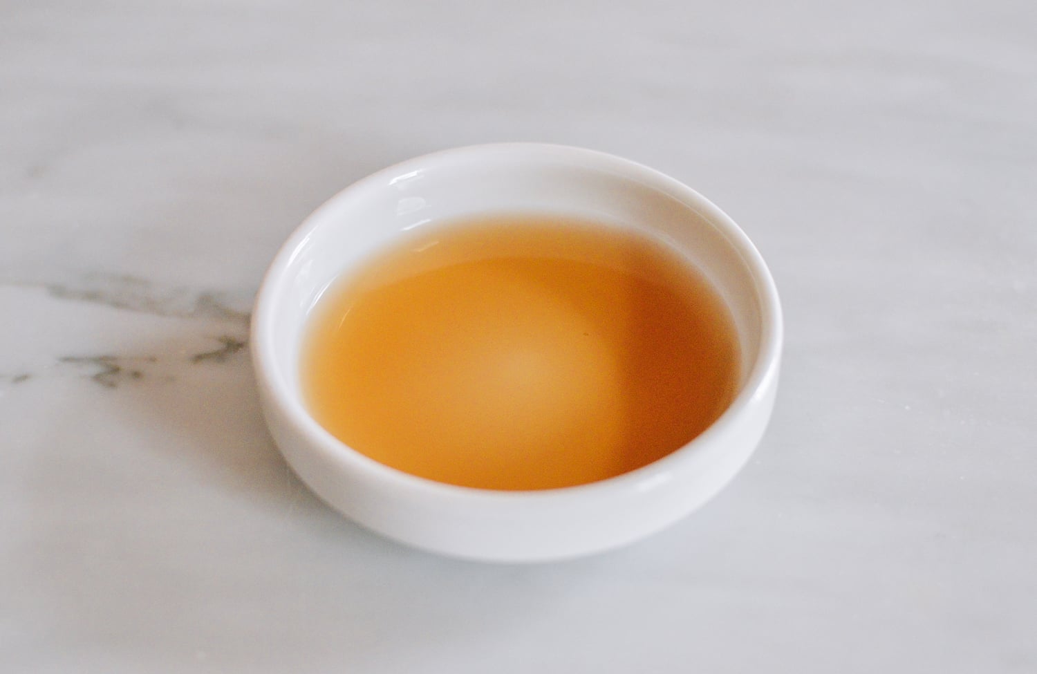 Shaoxing wine poured into a dish, thewoksoflife.com