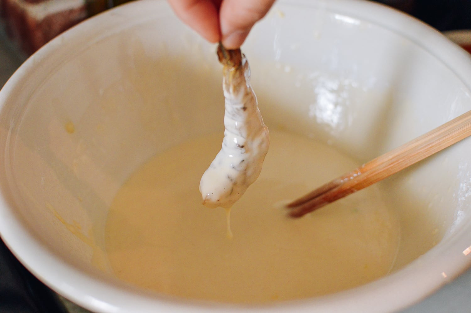 Dipping shrimp into tempura batter, thewoksoflife.com