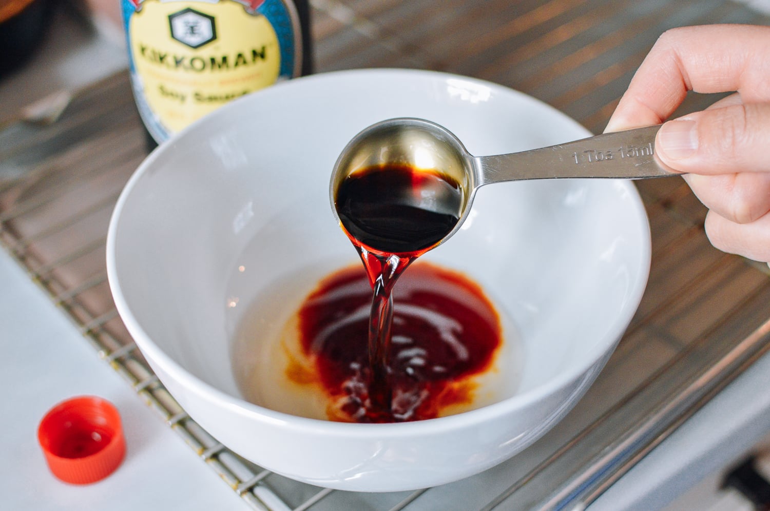 Making tempura dipping sauce with soy sauce, mirin, and dashi, thewoksoflife.com