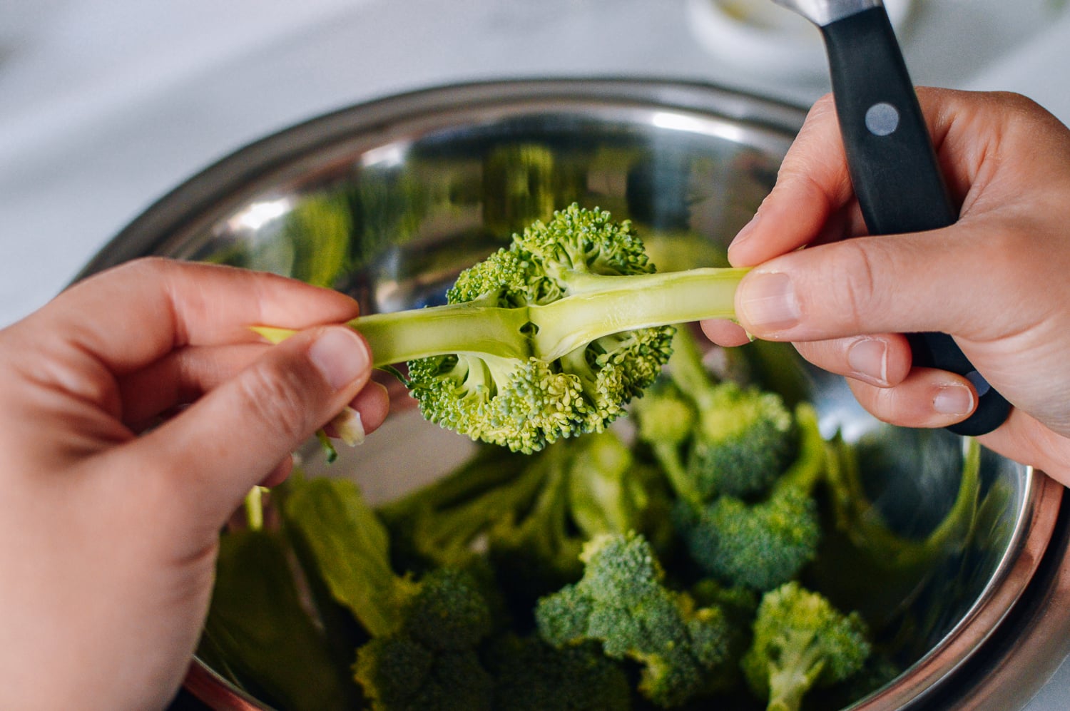 Breaking apart broccoli florets, thewoksoflife.com