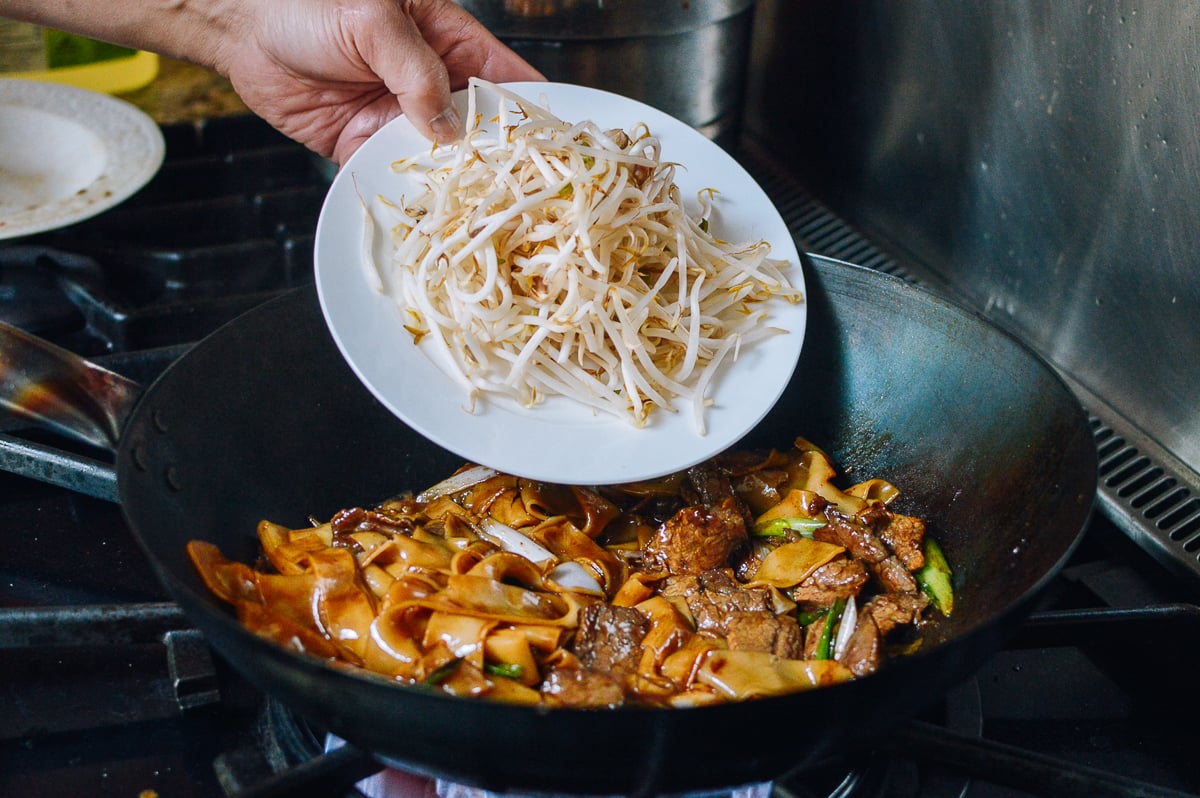 Adding bean sprouts, thewoksoflife.com