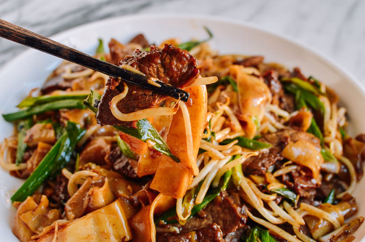Chopsticks picking up beef chow fun, thewoksoflife.com