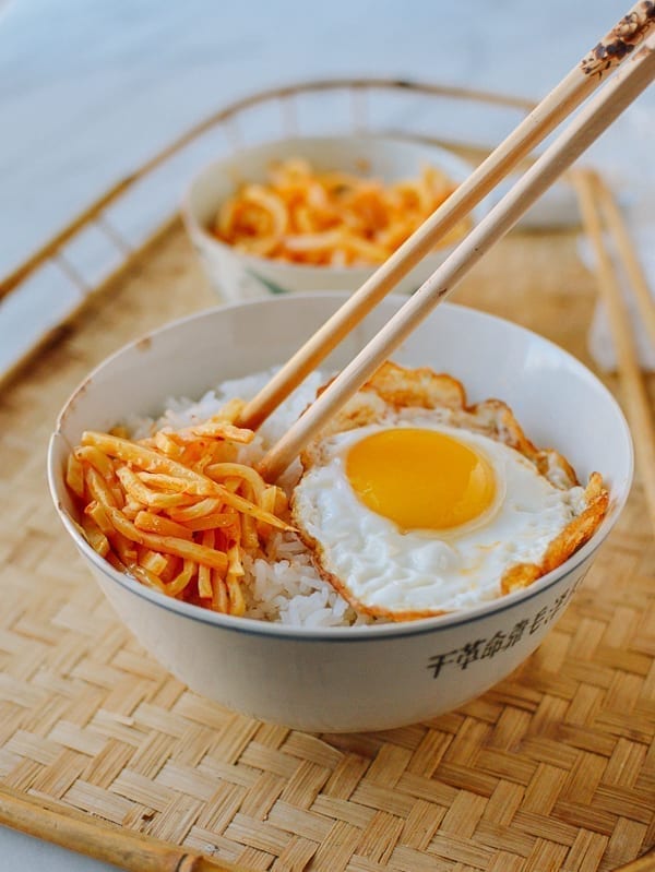 Chili bamboo shoots over rice with an egg, thewoksoflife.com