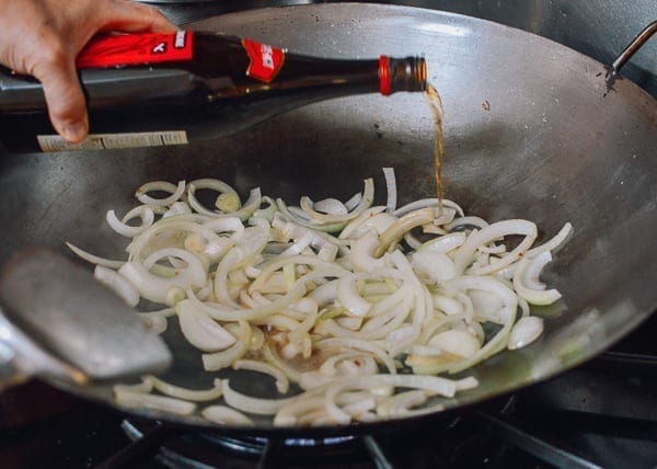 Adding Shaoxing wine to the onions, thewoksoflife.com