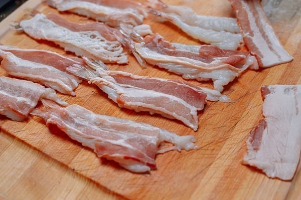 Pressing bacon on shrimp, thewoksoflife.com