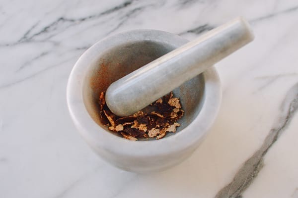 Dried Tangerine Peel in mortar and pestle, thewoksoflife.com