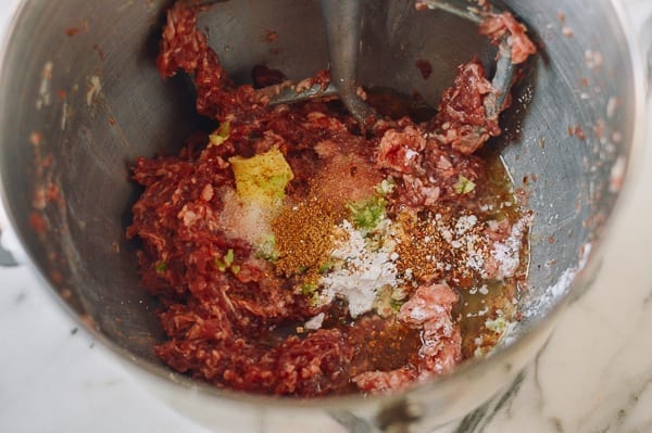 Adding seasoning ingredients to Chinese meatballs, thewoksoflife.com
