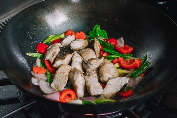 Adding fish back to wok, thewoksoflife.com