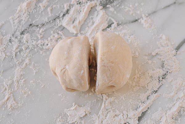 Cutting the dough in half, thewoksoflife.com
