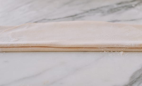 Layered noodle dough ready for cutting, thewoksoflife.com