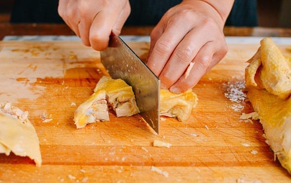 Cutting chicken thigh into small pieces, Chinese-style, thewoksoflife.com