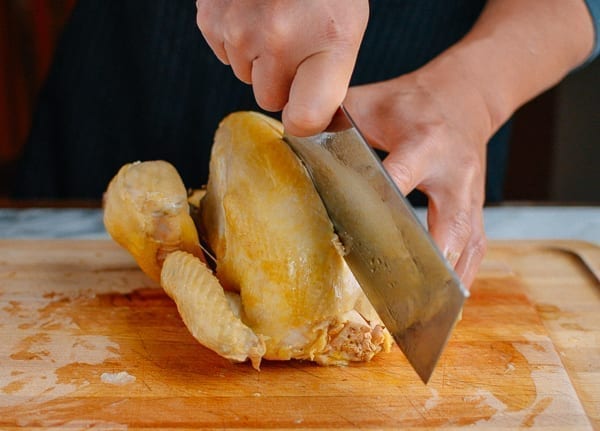 Splitting chicken in half, thewoksoflife.com