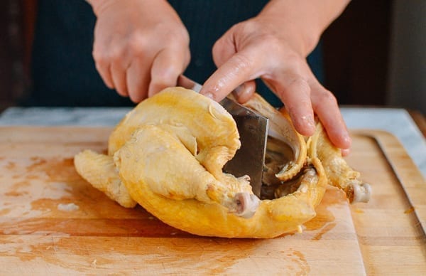 Splitting chicken in half, thewoksoflife.com
