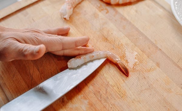 Butterflying shrimp from the underside, thewoksoflife.com