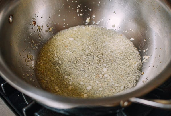 Minced ginger and garlic cooking in oil, thewoksoflife.com