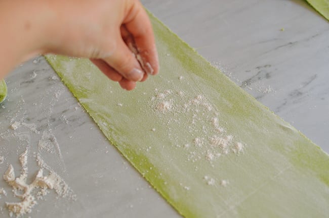 Flouring sheets of noodle dough, thewoksoflife.com