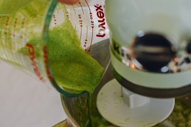 Adding spinach puree to flour mixture, thewoksoflife.com
