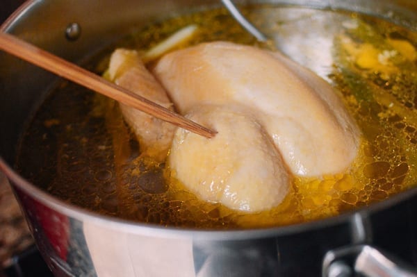 Poking chopstick into chicken to check for doneness, thewoksoflife.com