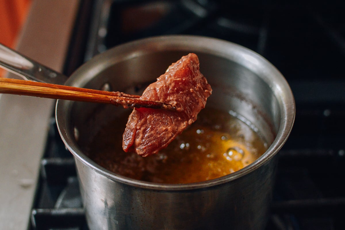 Add pork rib to frying oil, thewoksoflife.com