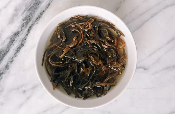 Rehydrated Dried kelp strips in a bowl by thewoksoflife.com