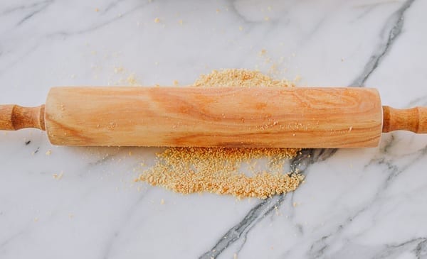 crushing crackers into crumbs with rolling pin, thewoksoflife.com