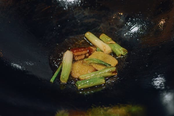 Ginger, scallions, and rock sugar cooking in wok with oil, thewoksoflife.com