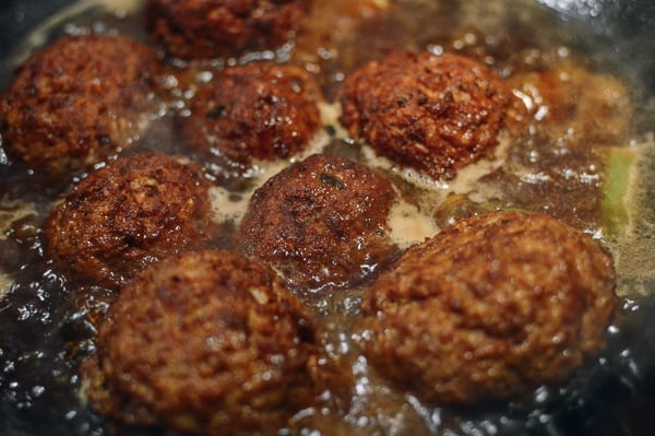 Braising lion's head meatballs in sauce, thewoksoflife.com