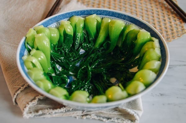 Blanched baby bok choy in serving bowl, thewoksoflife.com