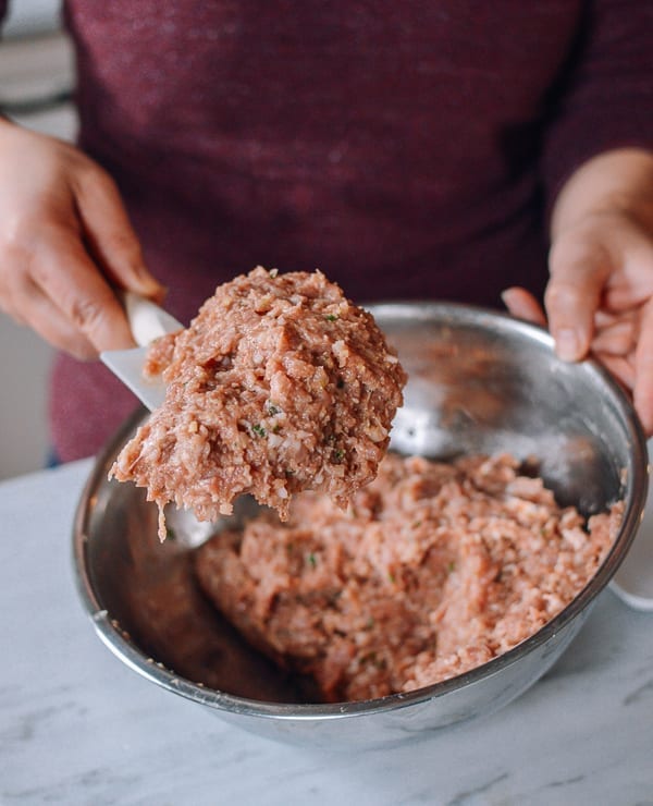 Whipping Chinese pork meatball mixture, thewoksoflife.com