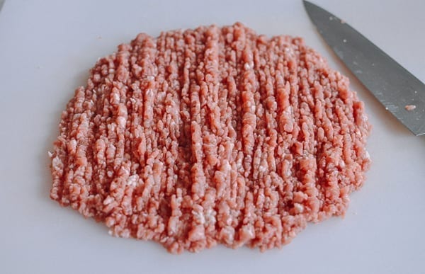 Hand chopping pork, thewoksoflife.com