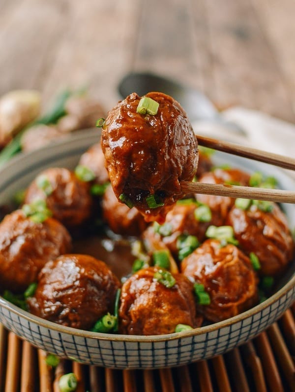 Picking up a braised stuffed gluten ball with chopsticks, thewoksoflife.com