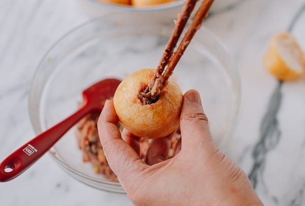 Stuffing fried gluten ball with filling, thewoksoflife.com