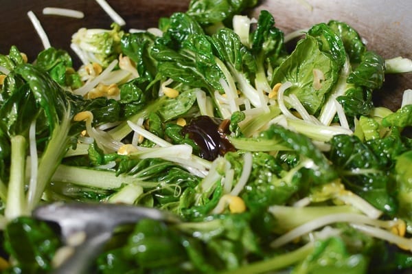 Adding oyster sauce, thewoksoflife.com